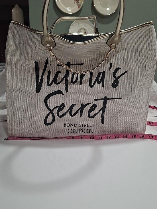 Victoria's Secret Handbags - Victoria's Secret Beige and Black Canvas Tote with Gold Chain Trim